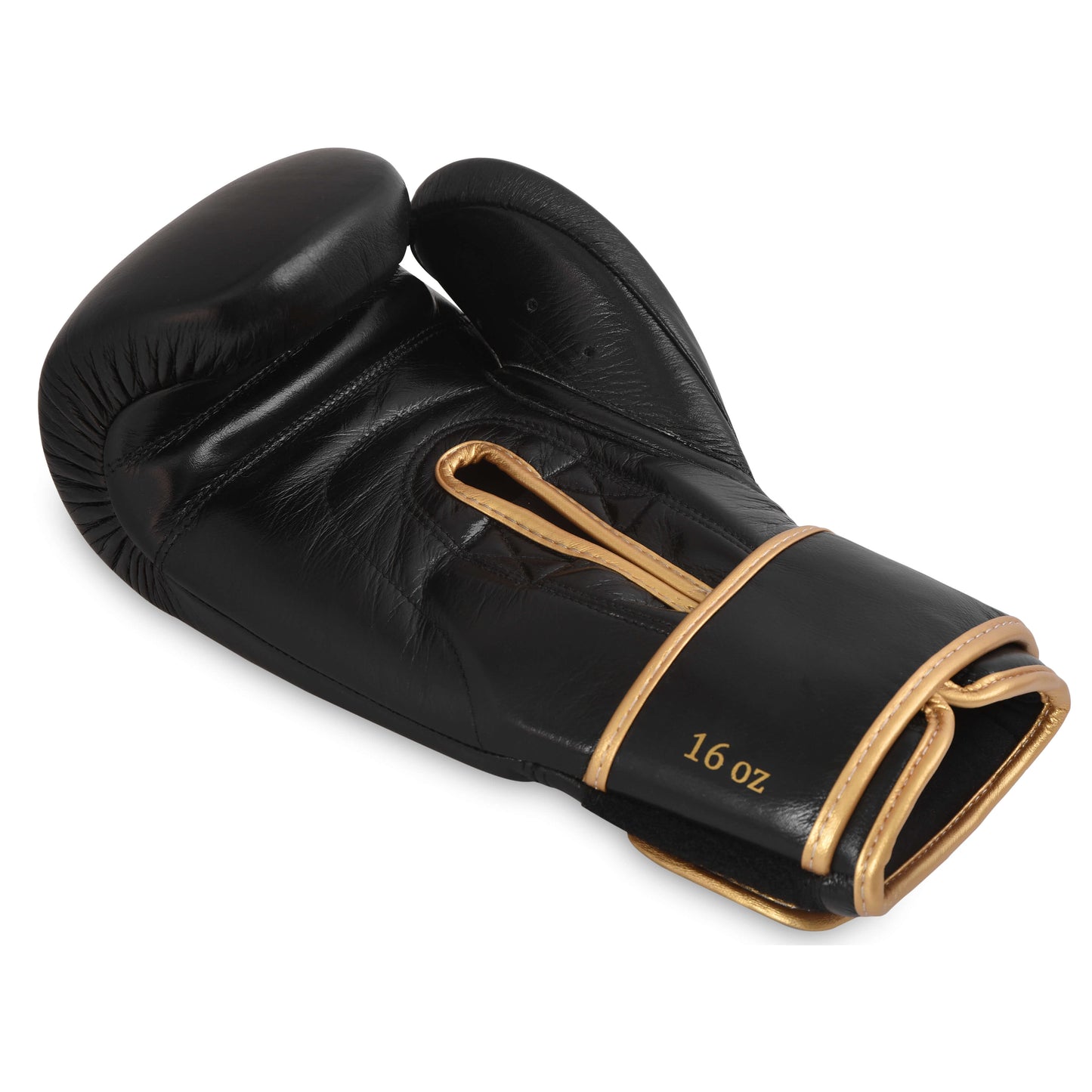 Flatlay of Fereli Shinken 16oz black boxing fight glove with gold trim and strap closure, designed for training sparring gloves and elite boxing kit online.