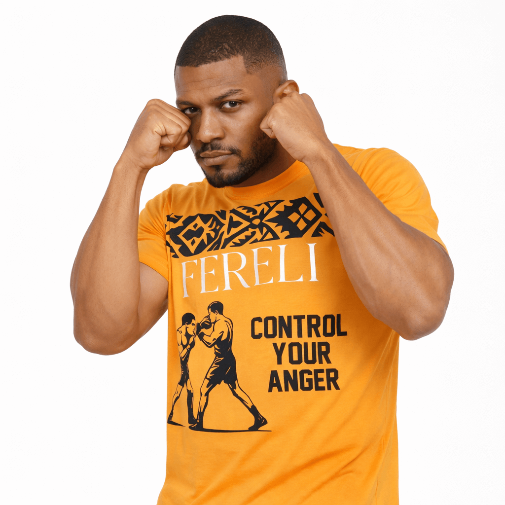 Male model wearing the Fereli Tempered T-Shirt in a boxing guard stance, showcasing the “Control Your Anger” statement and tribal pattern graphic on the front.
