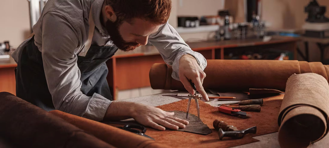 Close-up of a craftsman hand-stitching premium leather boxing gloves, showing detailed boxing glove craftsmanship explained.