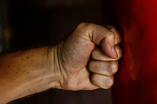 Bare fist showing correct knuckle alignment used in boxing gloves and punching mechanics to demonstrate proper punching technique.