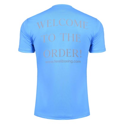 Back of Fereli sky blue t-shirt showing “WELCOME TO THE ORDER” message — standout design for boxing fans and athletes.