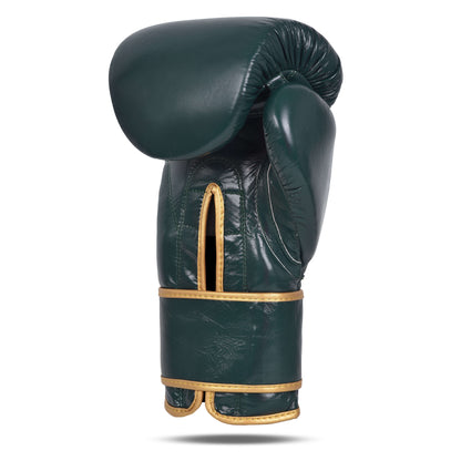 Angled rear view of Fereli Dastan strap boxing glove in deep green leather with gold trim, showing thumb curve and open wrist slit.