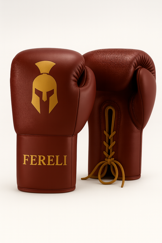 Fereli Ludus 16oz - lace boxing gloves for kickboxing, boxing and MMA in crimson red leather with gold detailing, inspired by Roman gladiators, on a white background.