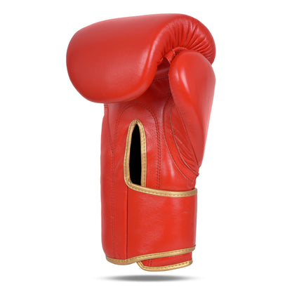 Backhand view of Fereli Ludus red boxing glove highlighting curved padding, wrist support, and gold-accented ventilation slit — perfect boxing gloves for kickboxing, now featured in our boxing gear sale and boxing equipment online store