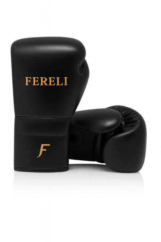 Black Fereli Phantom boxing gloves made from premium leather with gold branding, designed for beginner boxing equipment, kickboxing sparring, and foam boxing glove protection.