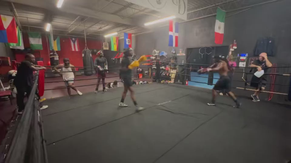 A video of two boxers sparring and one of them is wearing our Fereli Emberlight gloves.